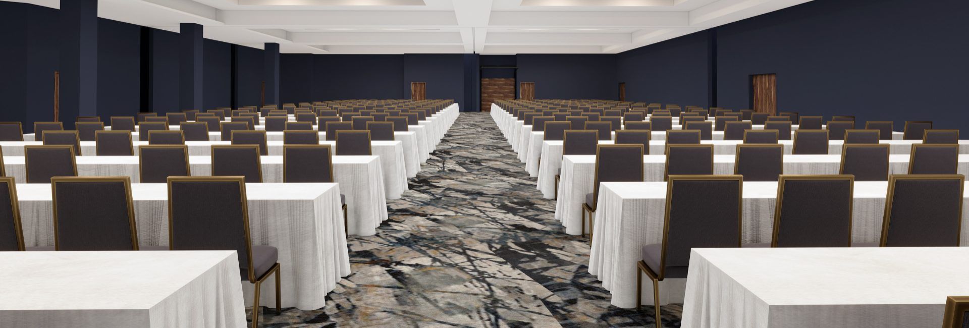 A conference hall with several tables and chairs